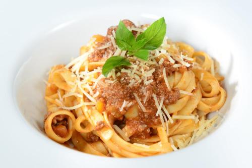 a bowl of spaghetti with meat sauce and cheese at Live Aqua Cancun - Adults Only - All-Inclusive in Cancún