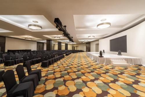 a large room with chairs and a screen in it at Live Aqua Cancun - Adults Only - All-Inclusive in Cancún