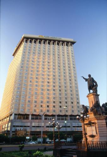 a large building with a statue in front of it at Fiesta Americana Reforma in Mexico City
