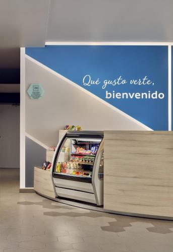 a refrigerator in a store with the words one crisis waited hermite at One Acapulco Diamante in Acapulco