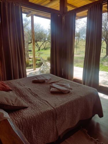 a bedroom with a bed and a large window at La Comarca Loft in San Javier