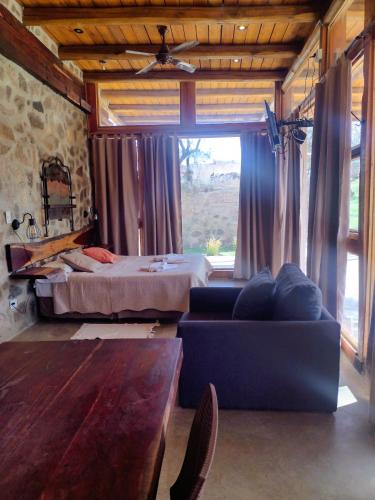a living room with a bed and a couch at La Comarca Loft in San Javier
