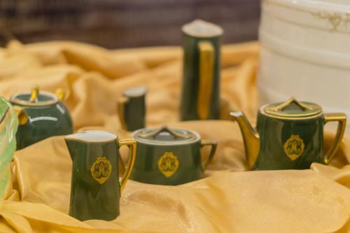 a group of green cups sitting on a table at Gamma Monterrey Gran Hotel Ancira in Monterrey