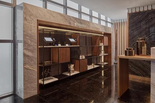 a room with a large wooden book shelf at Grand Fiesta Americana Chapultepec in Mexico City