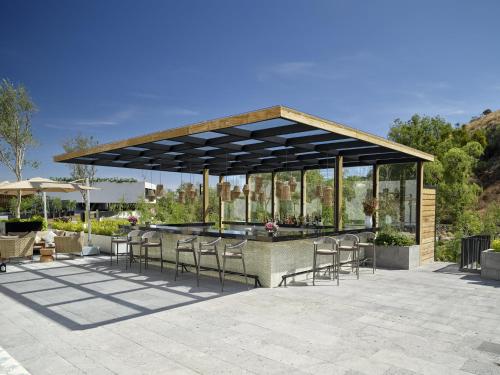 a pavilion with chairs and a table in a patio at Live Aqua San Miguel de Allende in San Miguel de Allende