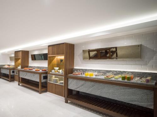 a bakery with many different types of food on display at Grand Fiesta Americana Chapultepec in Mexico City