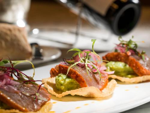 two plates of food on a white plate at Live Aqua Ciudad de Mexico Bosques de las Lomas in Mexico City