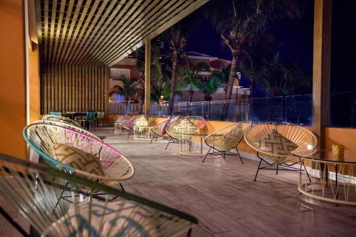 a group of chairs and tables on a patio at Grand Fiesta Americana Veracruz in Veracruz