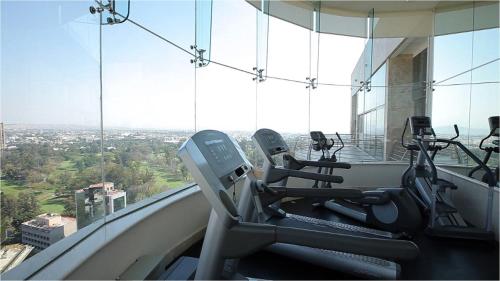 a gym with cardio equipment in a building at Grand Fiesta Americana Guadalajara Country Club in Guadalajara