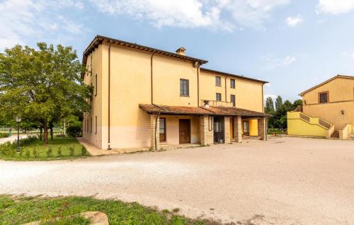 an old building with a lot of windows at 1 Bedroom Awesome Apartment In Montone in Montone