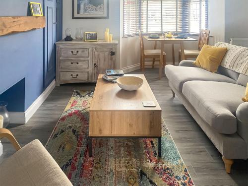 a living room with a couch and a coffee table at Clementi - Uk47197 in Penrith