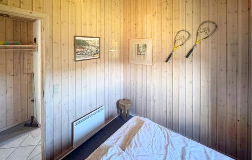a room with two tennis rackets on the wall at Nice Home In Otterup With Kitchen in Otterup