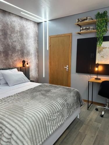 Ένα ή περισσότερα κρεβάτια σε δωμάτιο στο Studio in Joinville, piscina - Pet Friendly
