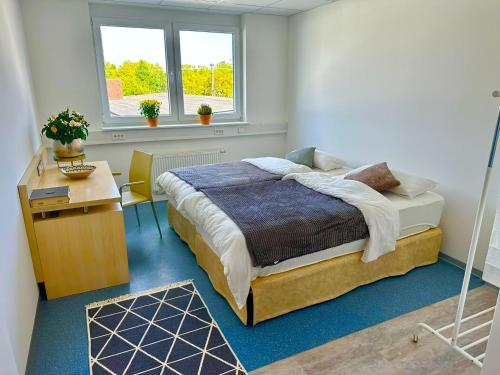 Postel nebo postele na pokoji v ubytování Donau-Iller Vermietung 24 GmbH