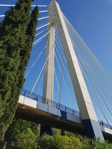 a bridge in a city with trees at Hostal Casa Miguel Marbella in Marbella