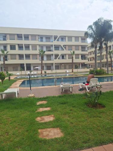Piscina en o cerca de Appartement neuf avec piscine, balcon et à deux pas de la mer"