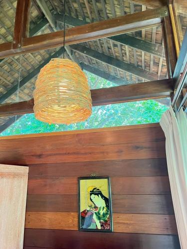 a chandelier hanging from the ceiling of a room at Nachan The Antique Courtyard in Chiang Khan