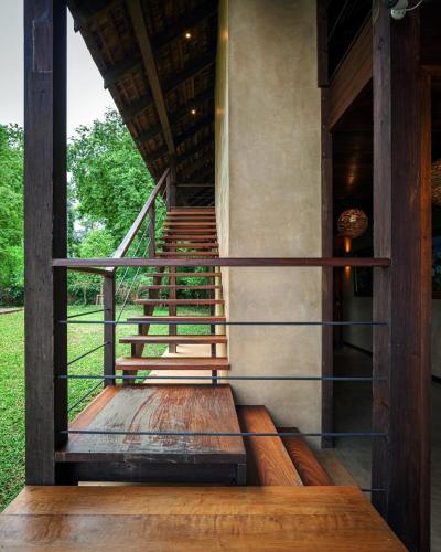 a view of the stairs of a house at Nachan The Antique Courtyard in Chiang Khan