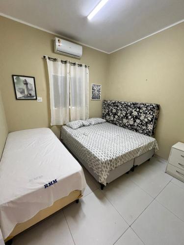 a bedroom with two beds in a room at Casa Brisas in Luis Correia