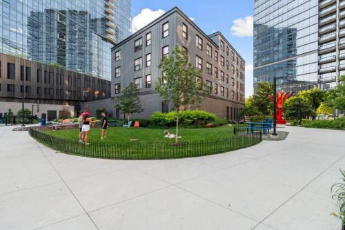two people standing in a park in a city at 3BR City Escape Bright Sleek Spacious in Chicago