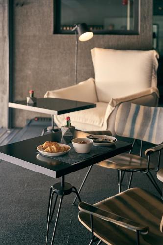 a living room with a table with food on it at Periscope in Athens