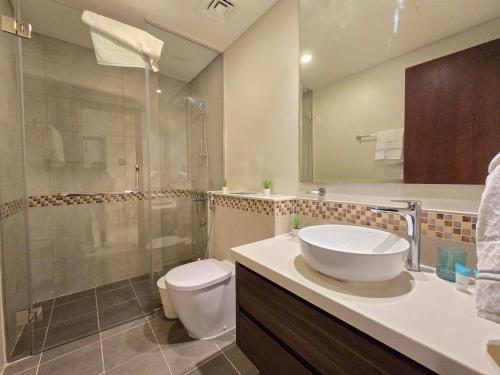 a bathroom with a sink and a toilet and a shower at 2BhK Big Balcony&Canal View Waterfront dubai mall in Dubai