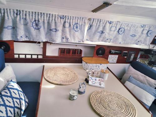 a table in the back of a boat at Romantic getaway on a sailboat in the Tagus in Lisbon