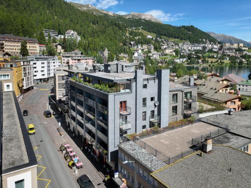 an aerial view of a city with a mountain at Apartment Chesa Ova Cotschna 802 by Interhome in St. Moritz