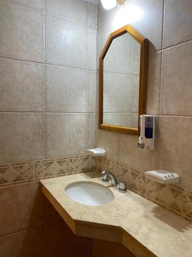 a bathroom with a sink and a mirror at Posada in Merlo