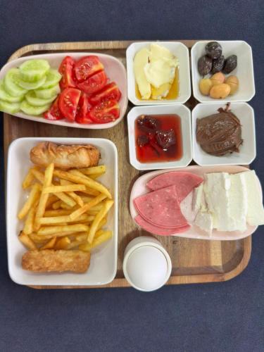 a tray with four trays of food on a table at Renaissance Apart Hotel in Trabzon
