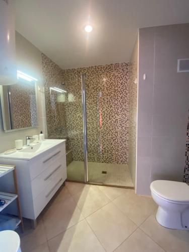 a bathroom with a shower and a sink and a toilet at Panorama in Calpe