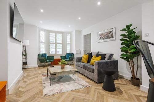 a living room with a couch and a table at Riverside Work-Stay Free Dedicated Parking in Warrington
