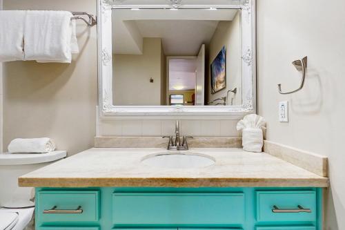 a bathroom with a sink and a mirror at Lahaina Shores 202 in Lahaina