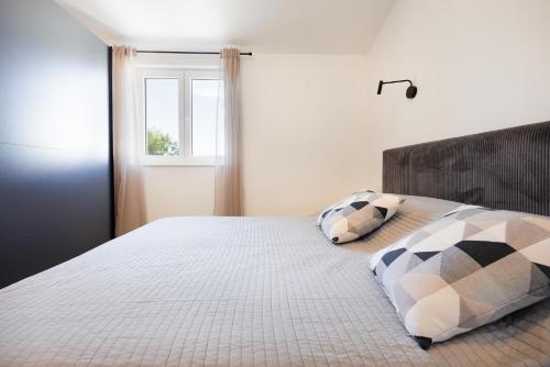 Postel nebo postele na pokoji v ubytování Apartments Opat
