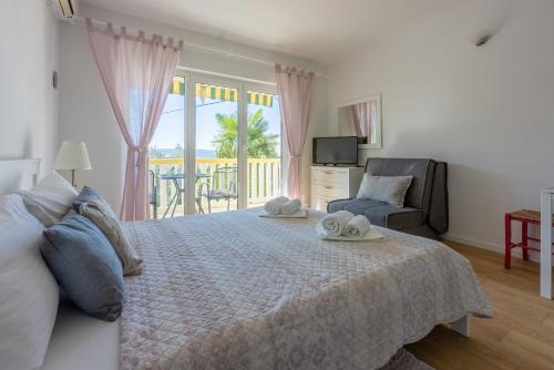 Ένα ή περισσότερα κρεβάτια σε δωμάτιο στο Apartments Neno