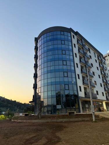 a tall building with a lot of windows at Diamond H in Podgorica