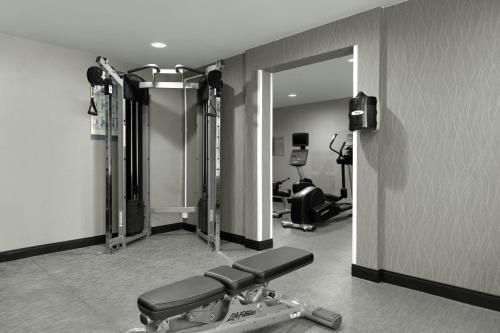 a room with a gym with a treadmill and a mirror at Courtyard by Marriott Santa Rosa in Santa Rosa