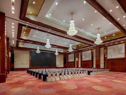 an empty room with a stage and a lecture hall at Pullman Guiyang in Guiyang