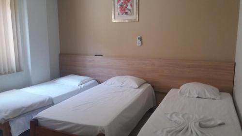 מיטה או מיטות בחדר ב-Hotel Vento Sul