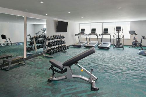 a gym with several treadmills and exercise bikes at TownePlace Suites by Marriott Niagara Falls Canada in Niagara Falls