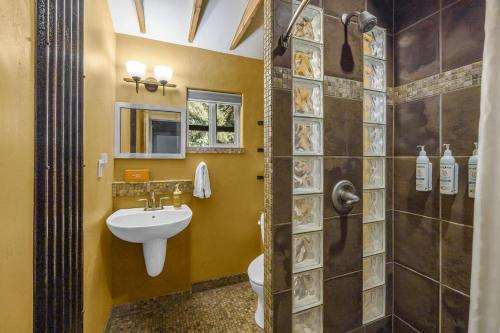a bathroom with a sink and a shower at Creekside 61 East - 2BR in Moab
