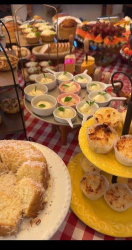 a table topped with plates of food on a table at Resort Magnifico in Monte Verde