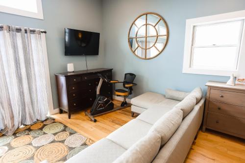 a living room with a couch and a television at Chasing the Slopes in North Woodstock