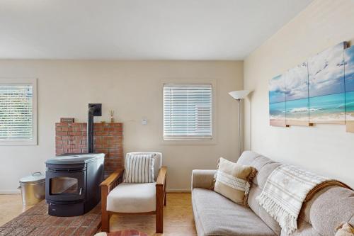 a living room with a couch and a fireplace at The Heart of Trinidad in Trinidad