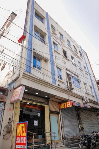 a large white building with a hotel sign on it at Hotel Siddhi Vinayak in Jodhpur