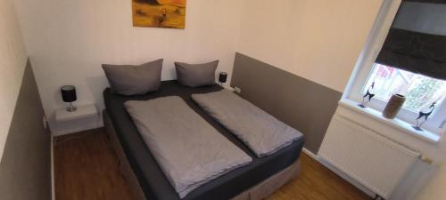 Ένα ή περισσότερα κρεβάτια σε δωμάτιο στο Ferienwohnung Strandparadies 7