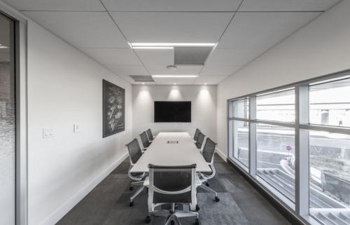 an office with a conference room with a table and chairs at Blueground Milpitas pool nr Ed R Levin Park SFO-2021 in Milpitas