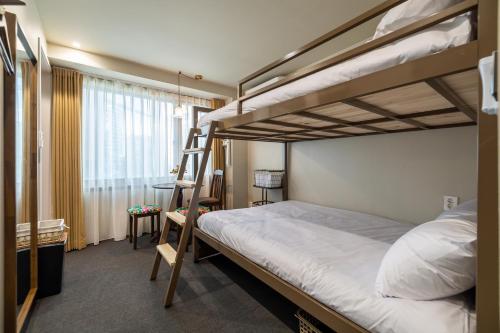 Un ou plusieurs lits dans un hébergement de l'établissement EXTAY Mansion Chungmuro