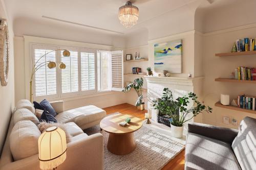 a living room with a couch and a table at Spacious 3BR Potrero Hill Home Free Parking Minutes to Moscone & Caltrain for Super Bowl in San Francisco