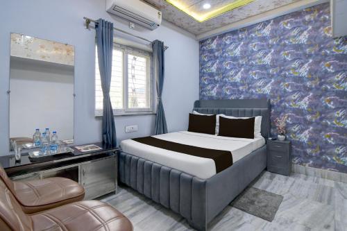 Ένα ή περισσότερα κρεβάτια σε δωμάτιο στο Hotel O Sitbasu